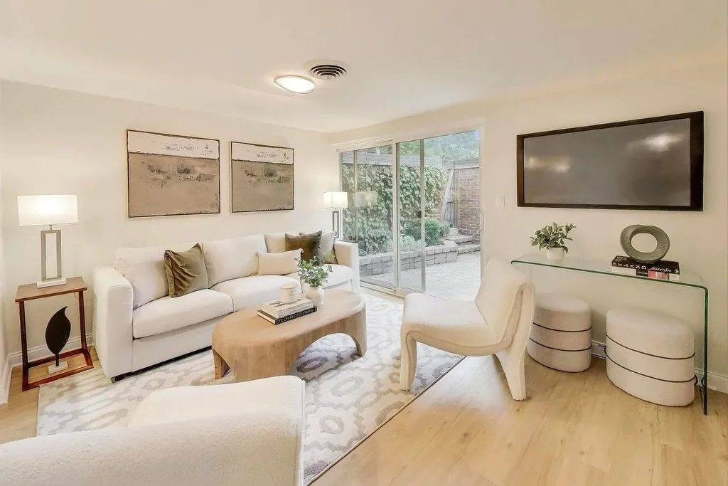 This home already offered a beautiful canvas, so our approach was about elevating what was there and creating cohesion across the main living spaces.

We leaned into warm, creamy neutrals throughout the living, dining, and family rooms, allowing each