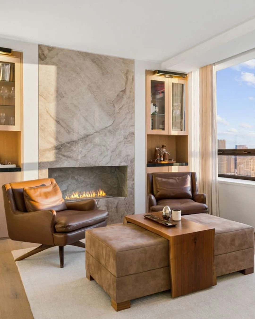 A coveted Chicago address deserves a coveted first impression.⁣
⁣
Residence 5601 at Water Tower Place already had the bones: sweeping lake views, a natural stone fireplace, and designer textiles, lighting, and finishes. It started with a consultation