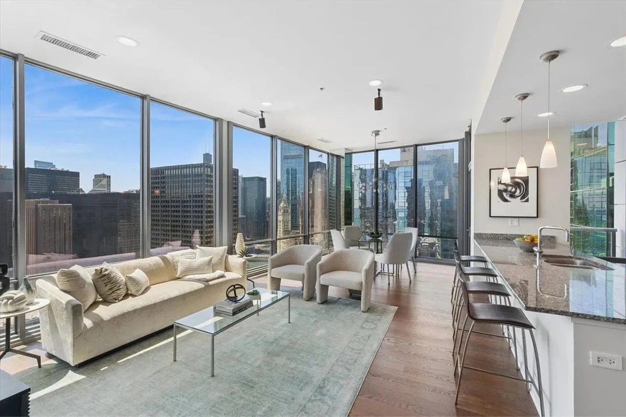 Staging is really an exercise in editing. Knowing what to remove, what to keep, and what to bring in to help a space reach its full potential.

This Streeterville corner penthouse is a great example. Our team started with an in-depth consultation, wa