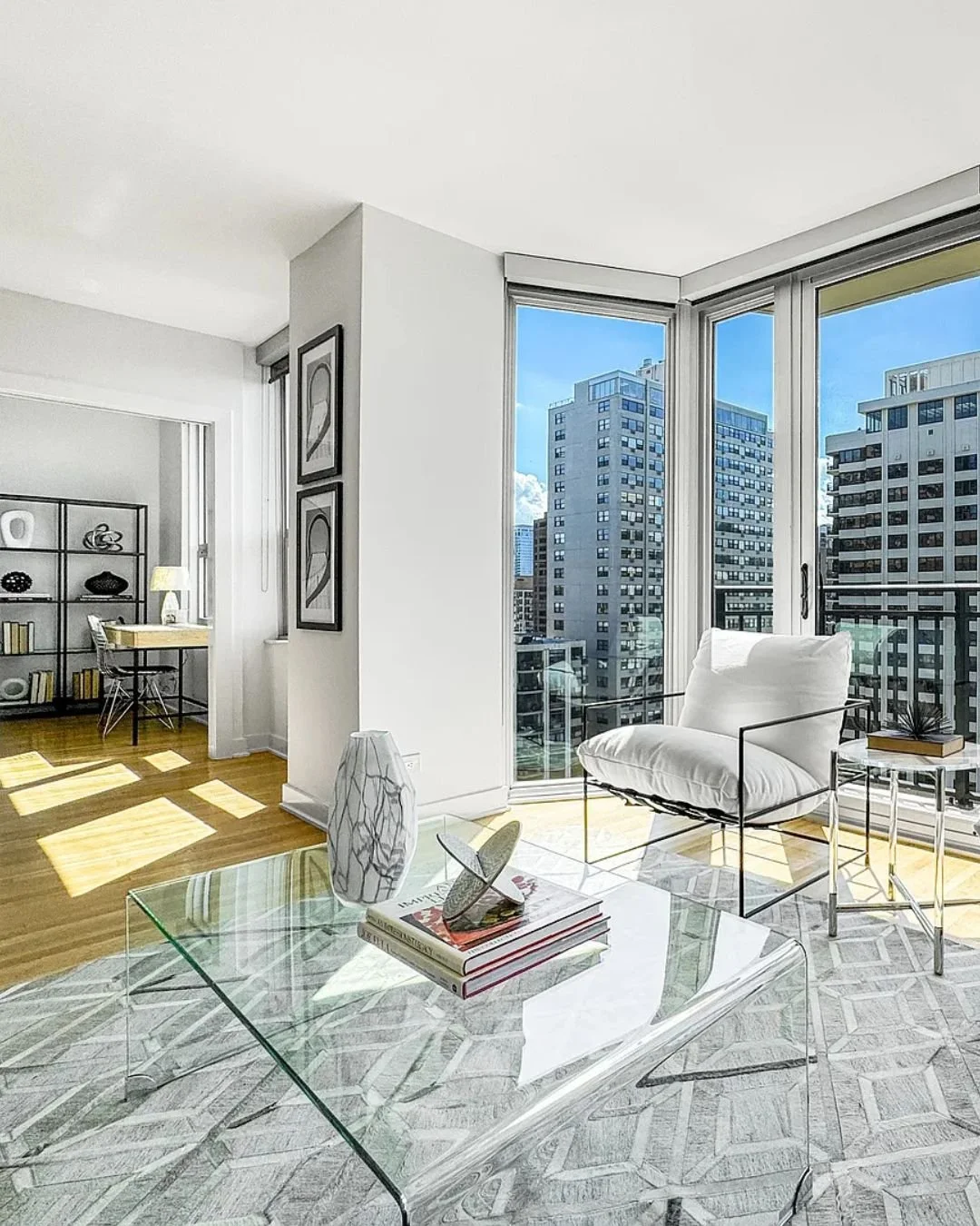 Do we ever get tired of staging with the Chicago skyline as the backdrop? No, we do not.

This corner unit at the Park Astor gave us floor-to-ceiling glass on two sides and a view that does half the work before we even walk in. We chose every design 