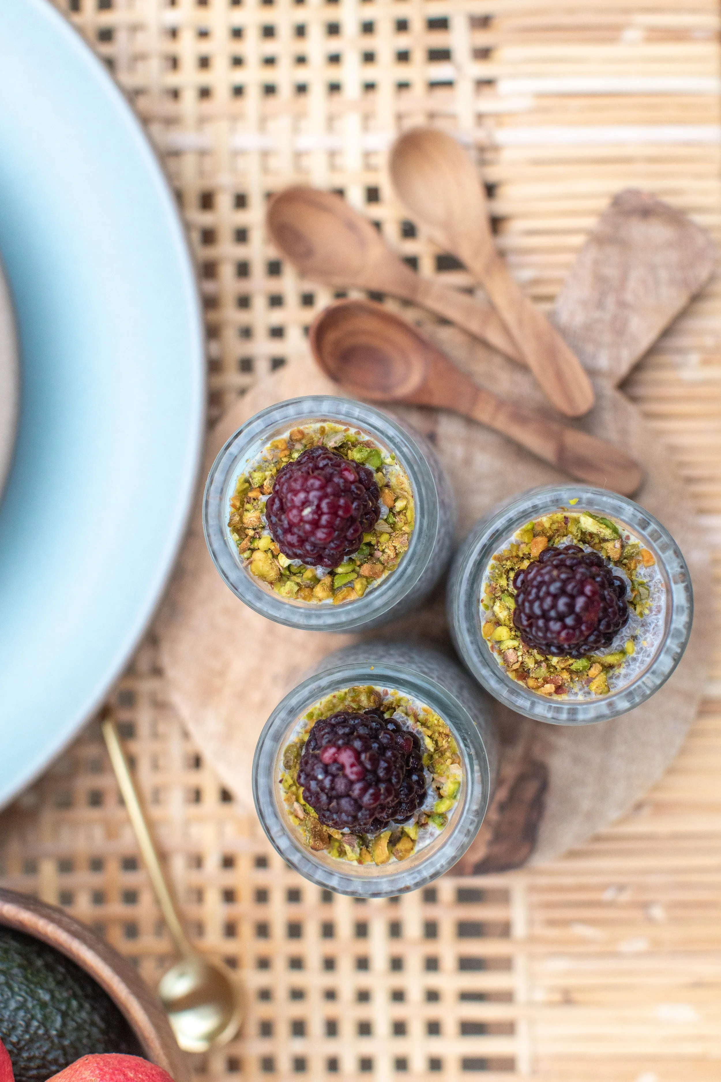 Chai seed pudding with crushed pistachios and blackberries