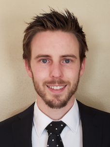 Headshot of Travis Linscome-Hatfield.