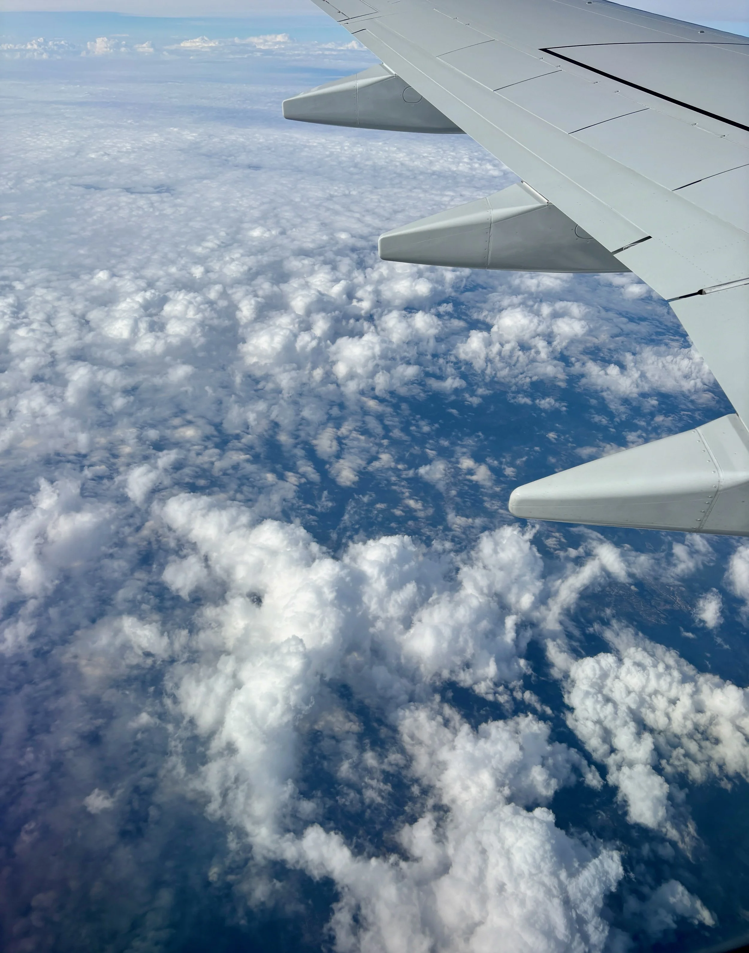 June 12 - A Sea of Clouds -
High above the world below - 
The clouds float by, layer upon layer - 
The clouds look like waves on a beach and the water is see through in the warm sun - 
My mind wanders back over the last few days adventure and I miss 