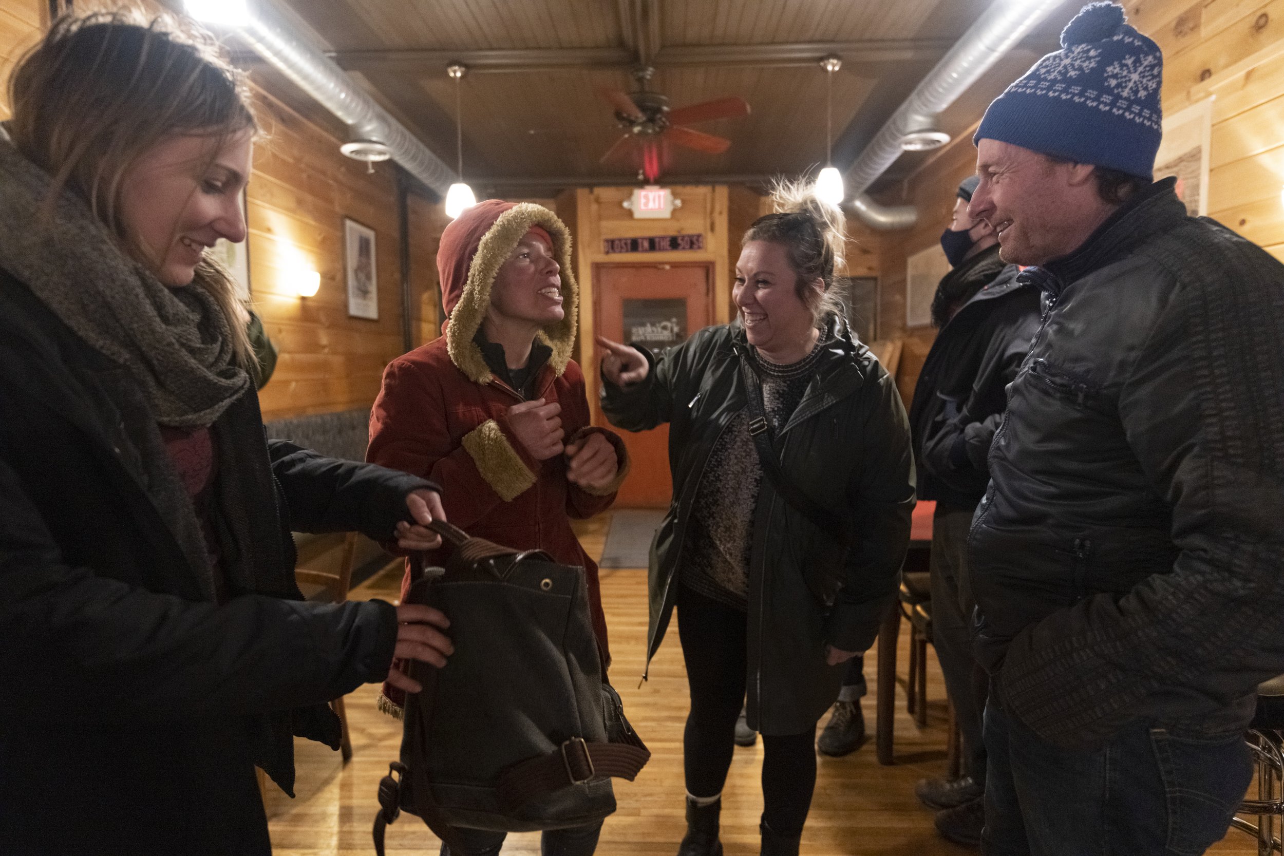  Chloe Smith, Jillian, Courtney Klee, and Andy Dunning get ready to say their goodbyes for the night at Dickies on December 4, 2021 in Rochester, N.Y.  