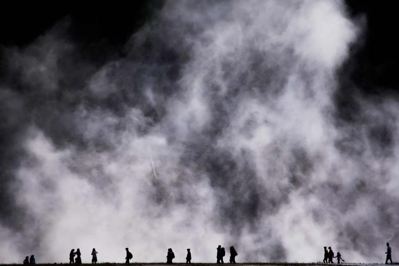  Visitors of Yellowstone National Park, W.Y. walk along the boardwalk at the Emerald Pool on August 3, 2018. The steam rising into the air creates a surreal scene during the day.  