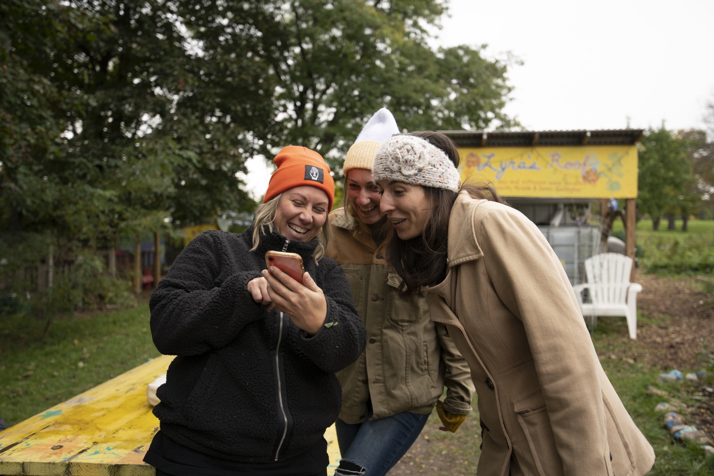  From left, Courtney Klee, Chloe Smith, and Gabi Kosoy share a laugh at a video on Klee’s phone at 490 Farmers in Rochester N.Y. on Oct. 23, 2021.  