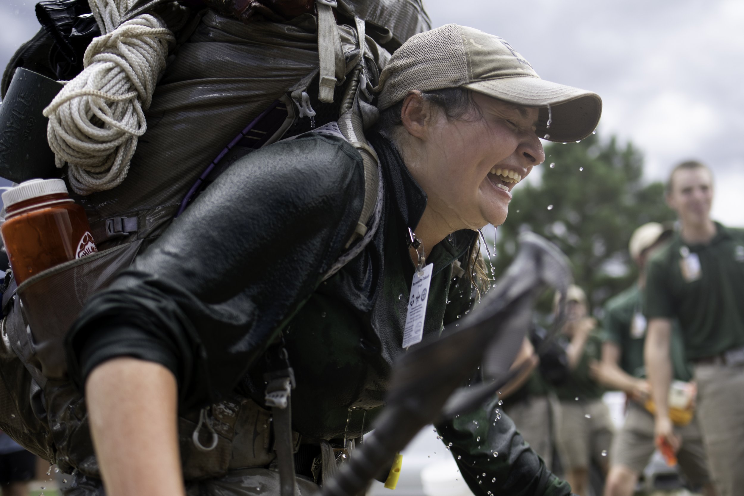  Rayado ranger, Bernadette Takash, runs back into base camp after getting drenched by close friends at Philmont Scout Ranch on July 9, 2022 in Cimarron, N.M.  