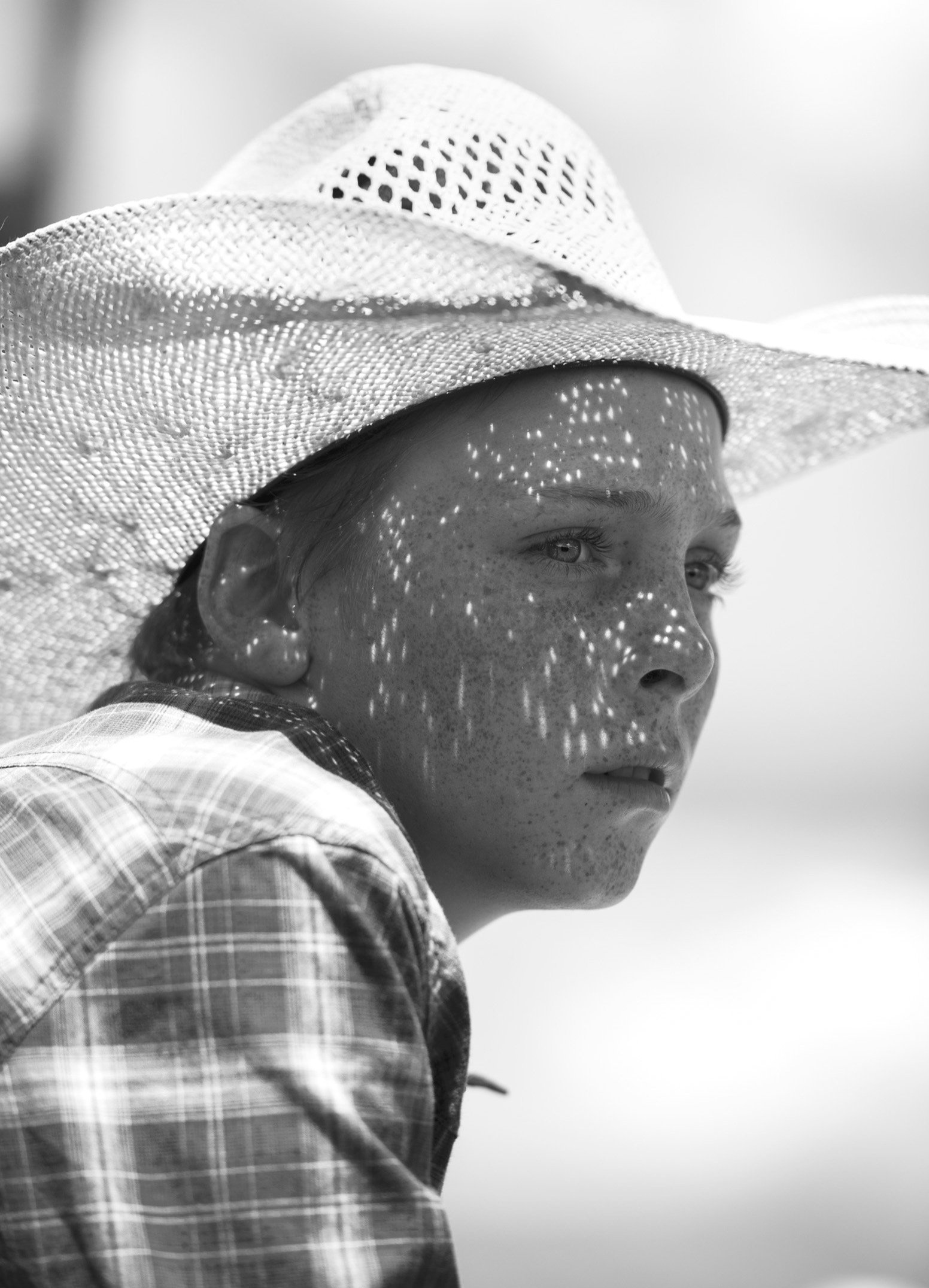  A local cowboy watches The Maverick Club rodeo in Cimarron, N.M. on July 4, 2021. The event is the longest running open rodeo in the west.  