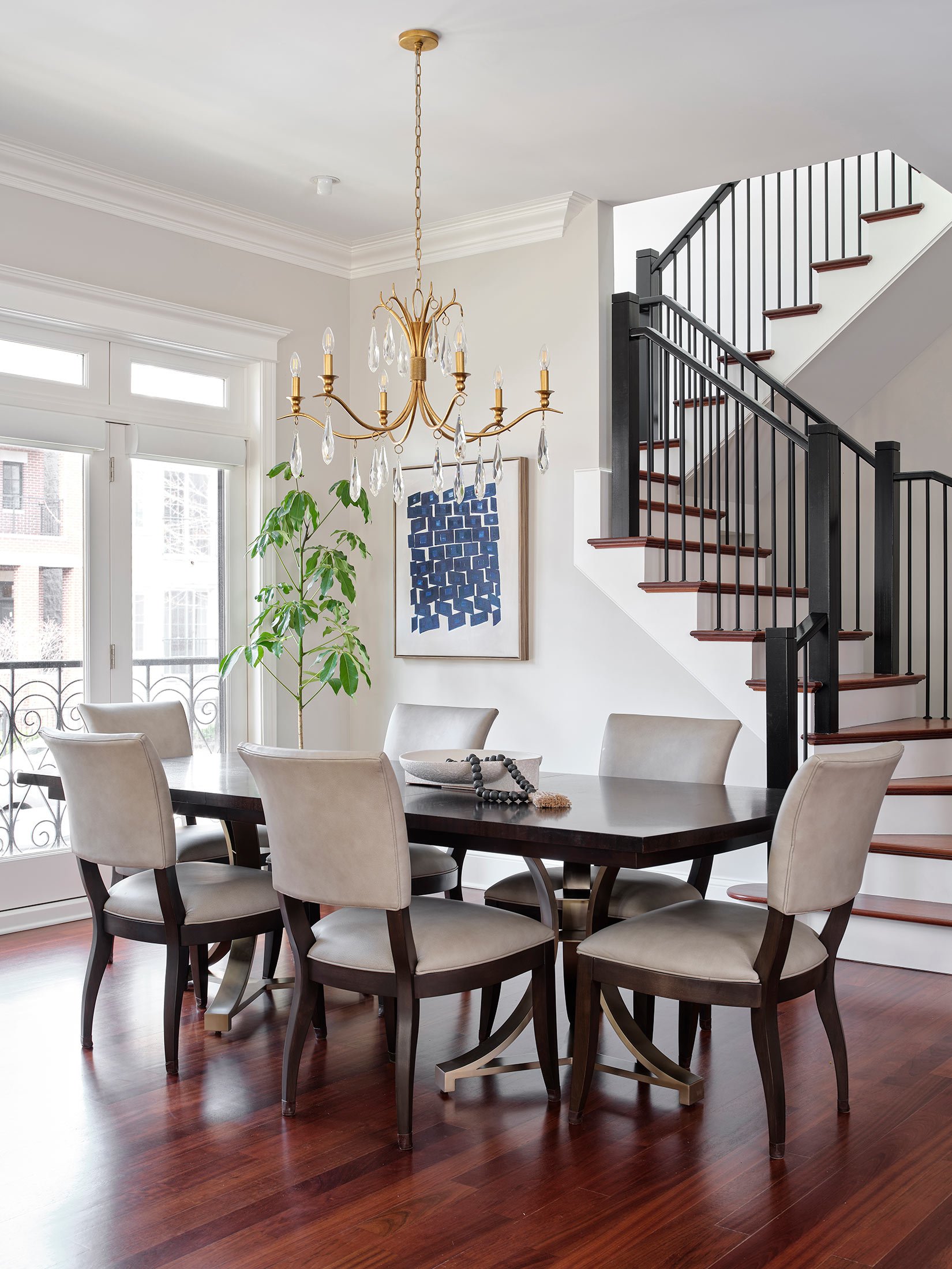 Architecturally inspired contemporary painting in an open-plan dining area.