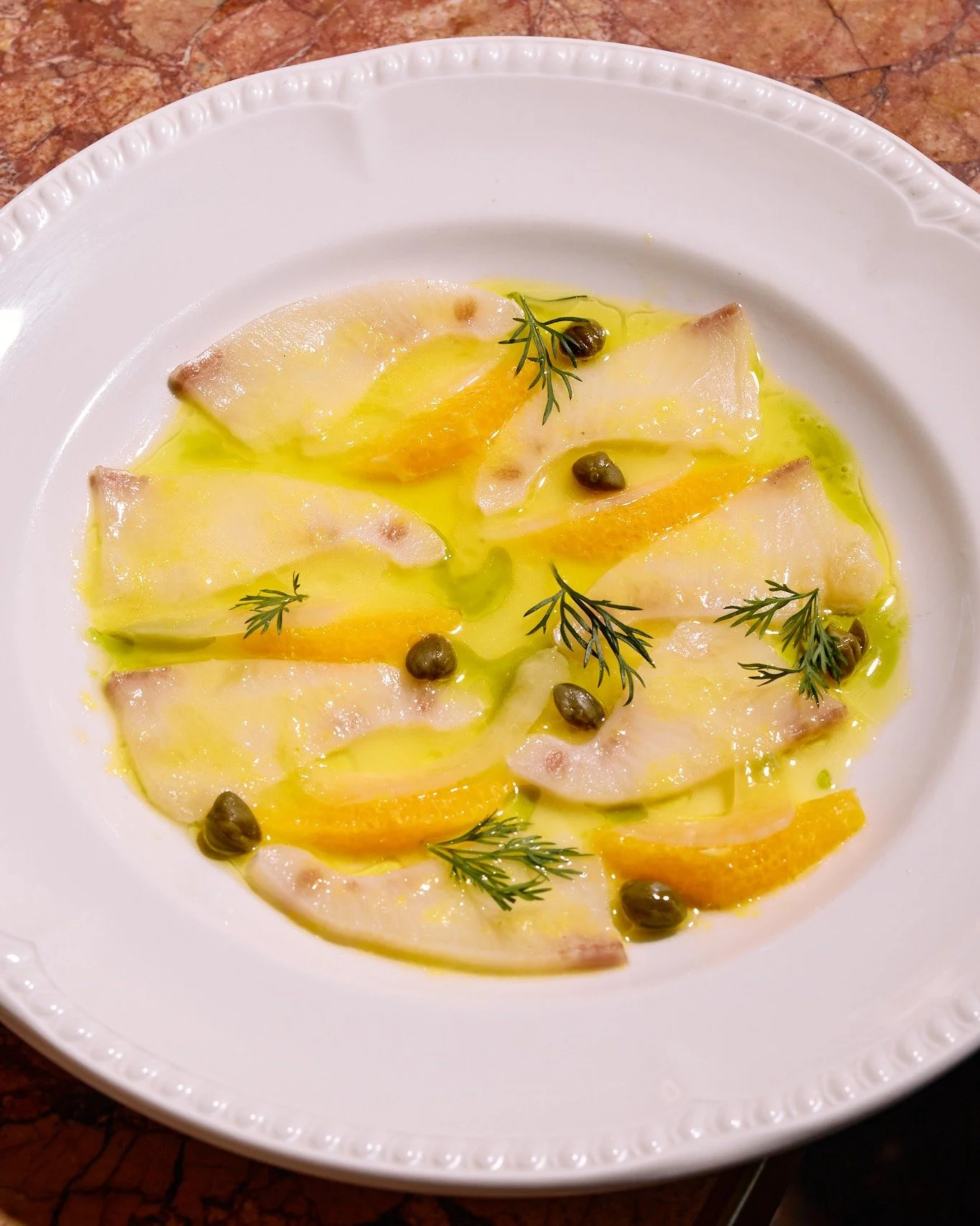 Fresh, vibrant, and oh-so moreish! Raw Kingfish with a zingy citrus-orange twist. 

https://www.yamasrestaurant.com.au/ 

#thisisbrisbane #westendbrisbane #greekfood