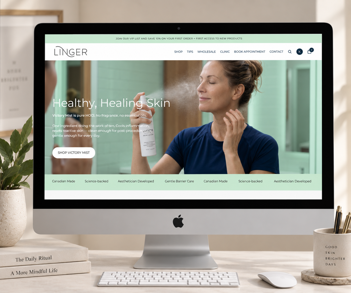 Computer screen displaying a skincare website called Linger, featuring a woman spraying mist onto her face with product details and a green background.