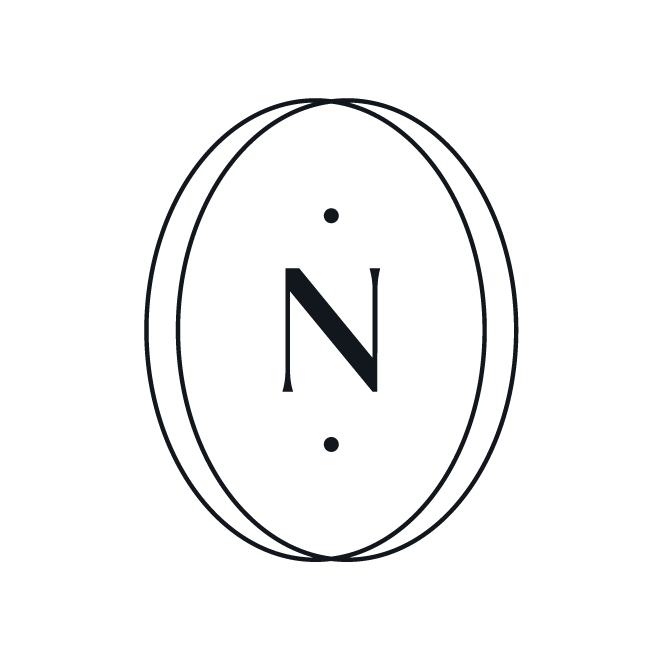 Minimalist logo with the letter 'N' inside an oval, flanked by dots.