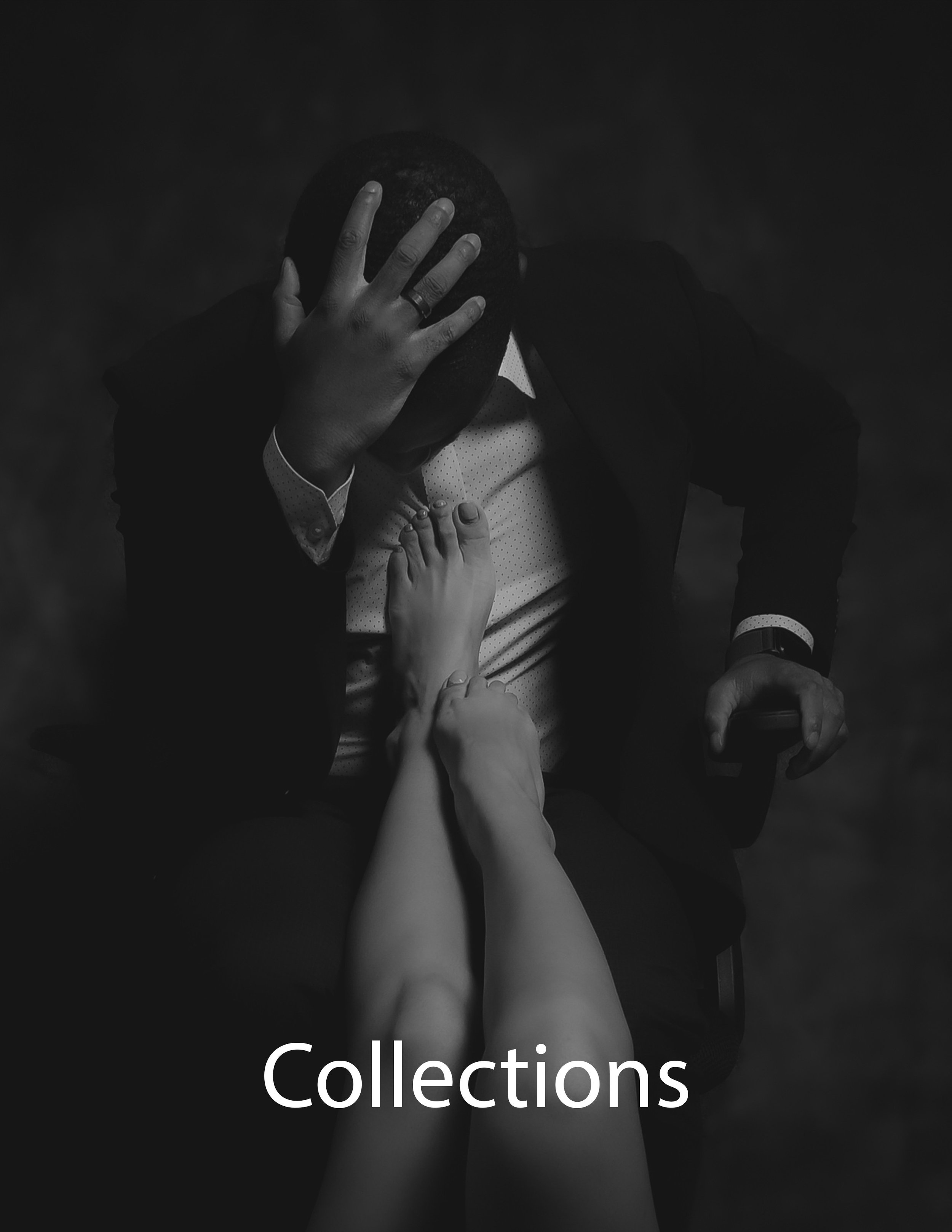 Black and white photo of a man in a suit sitting in a chair, holding his head with his left hand, and two bare arms reaching up and touching his chest from below. The word 'Collections' is written at the bottom of the image.