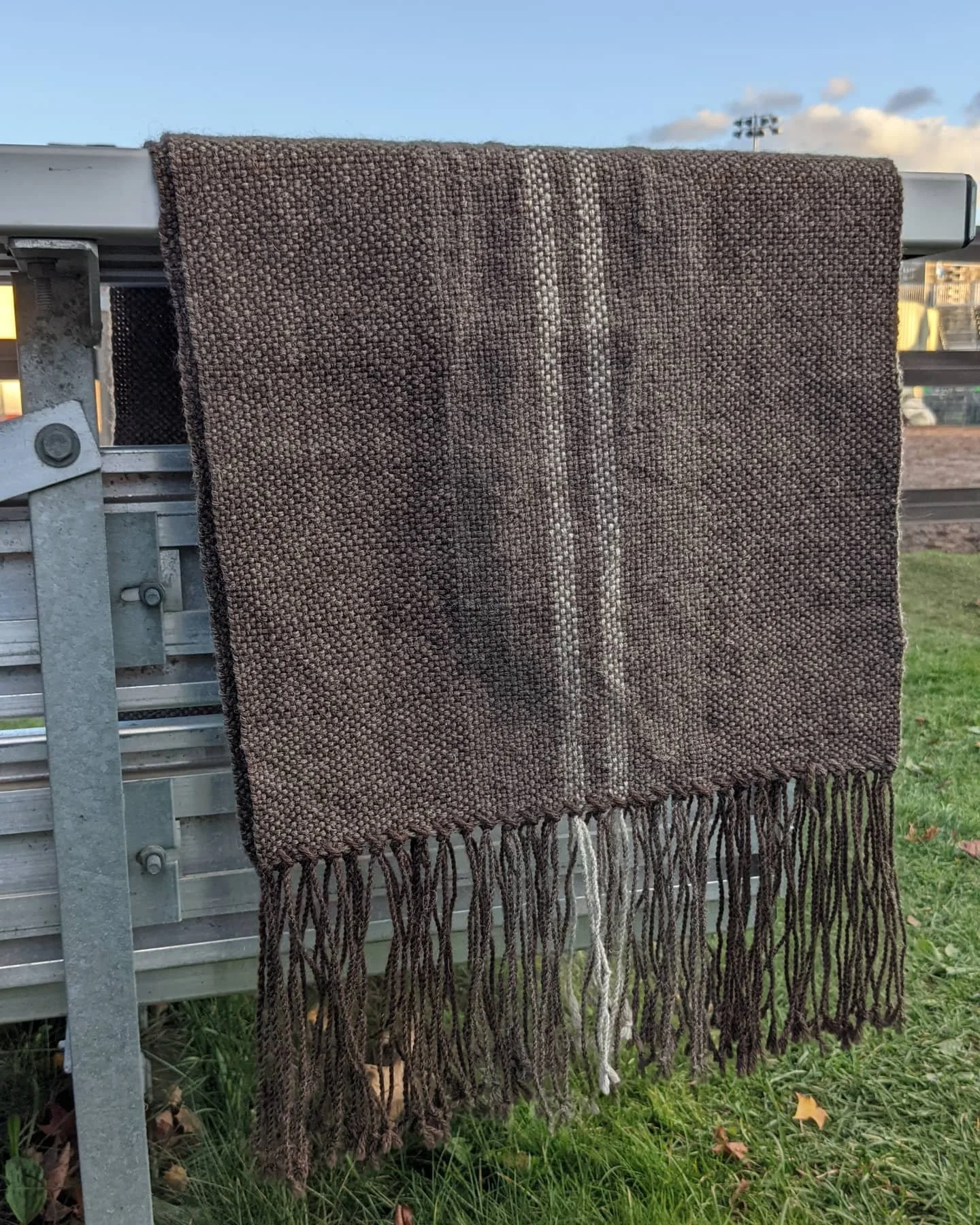 14”x76”, 100% wool scarf with 6” twisted fringe. Woven on a Rigid Heddle Loom.