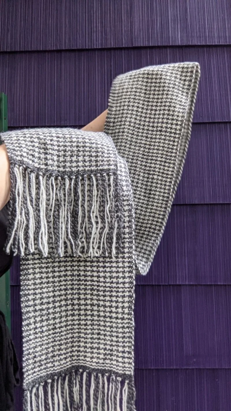 100% wool houndstooth scarf. Woven on a Rigid Heddle Loom.