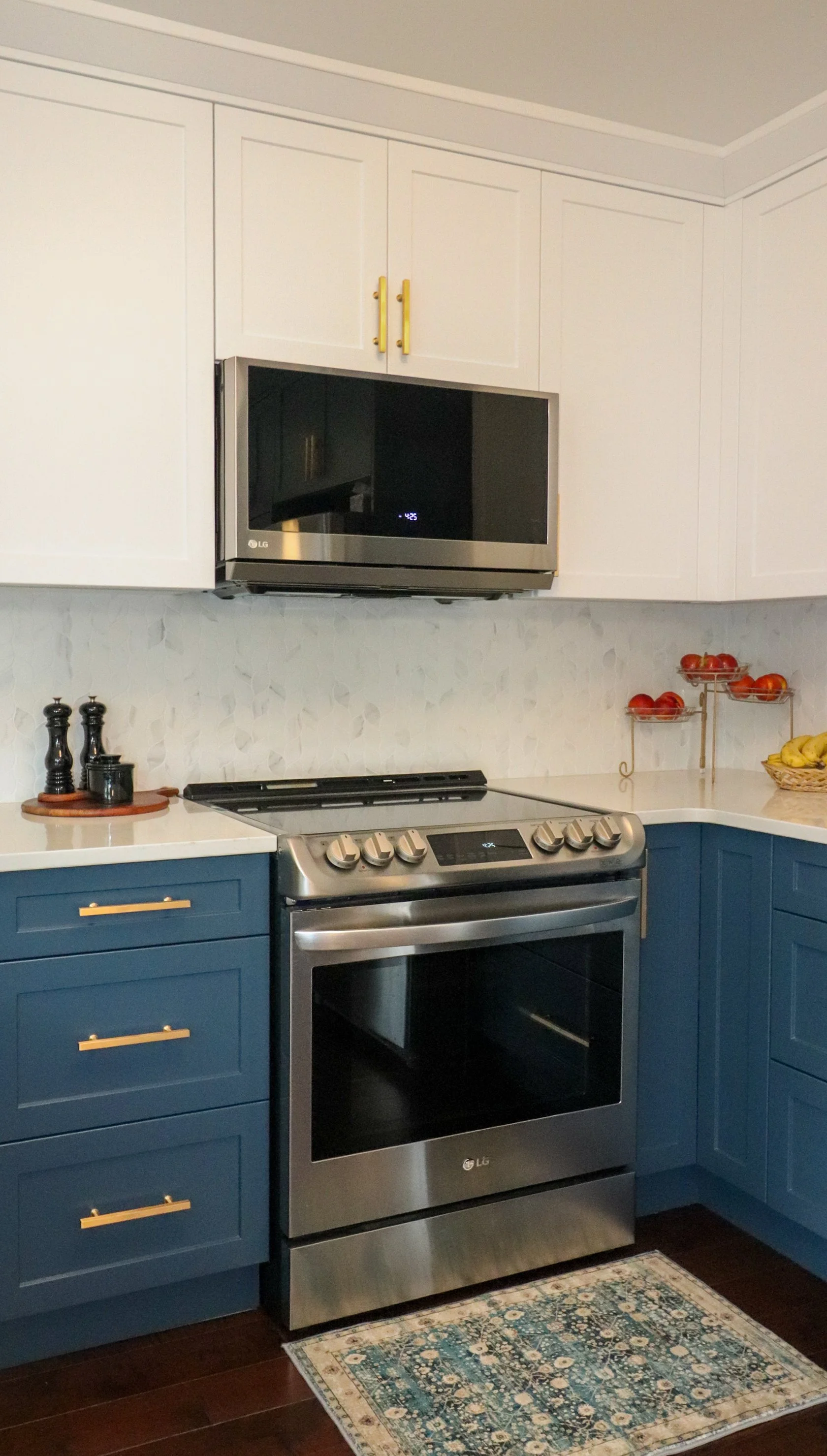 Range wall with microwave, Diamond Frost uppers and blue lower cabinets.