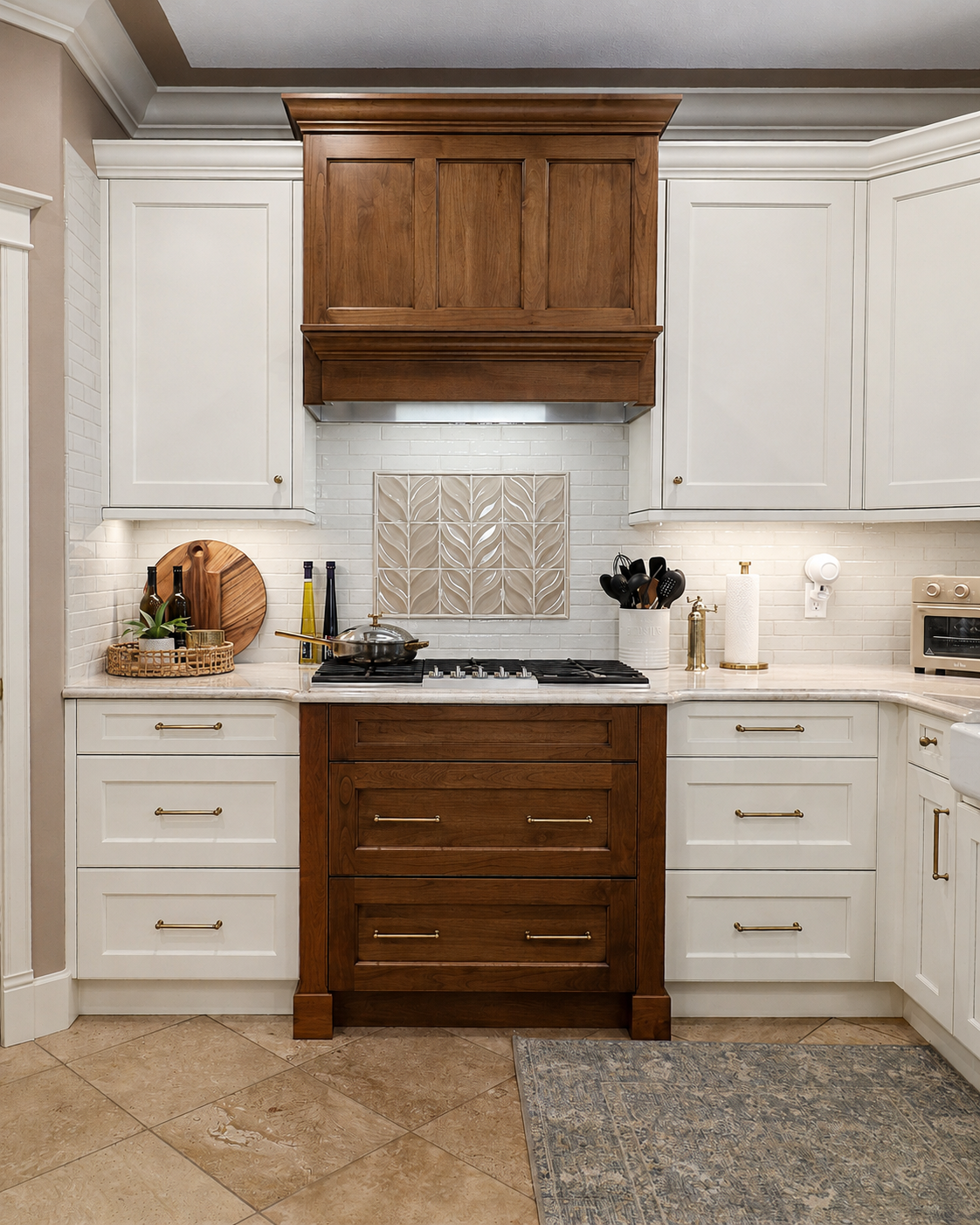 Symmetrical cooktop wall with Crisp Linen cabinetry and black-glazed alder hood.