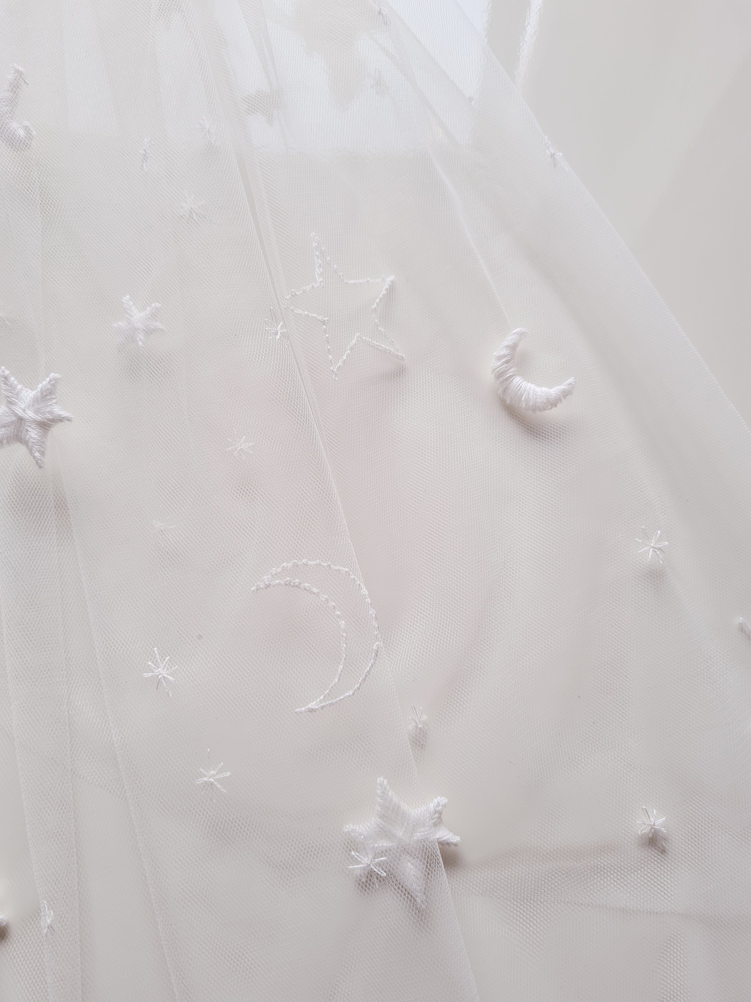 wedding veil with embroidered stars and moons on ivory tulle