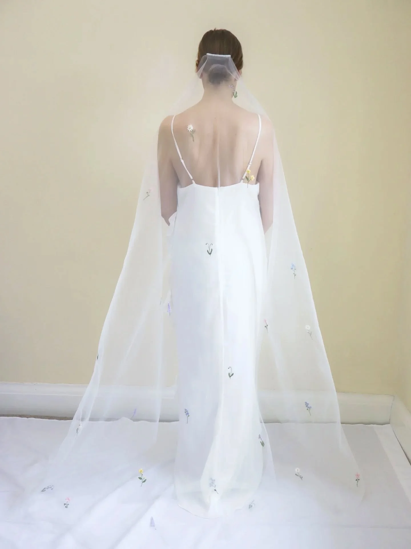 Introducing the Ella English Garden Veil&nbsp;

A hand embroidered veil inspired by the beauty of the British countryside scattered with snowdrops, bluebells, daisies, and other significant wildflowers.

Made from soft, sheer tulle in a timeless drop