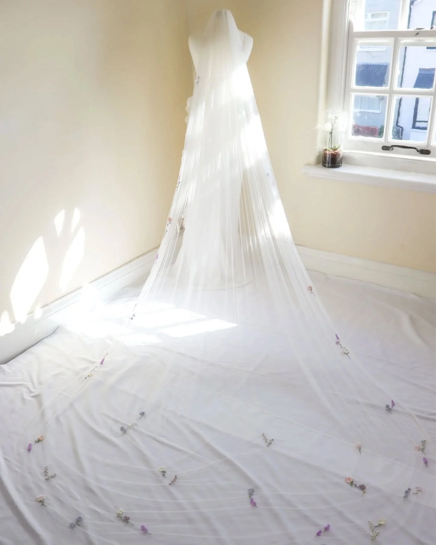 Silk tulle is such a lovely and delicate fabric to work with 🤍 Despite being extremely soft, with stretch, it's quite forgiving and holds up well to hand embroidery.

The flowers on this silk veil were embroidered in dusky and pale colours of thread