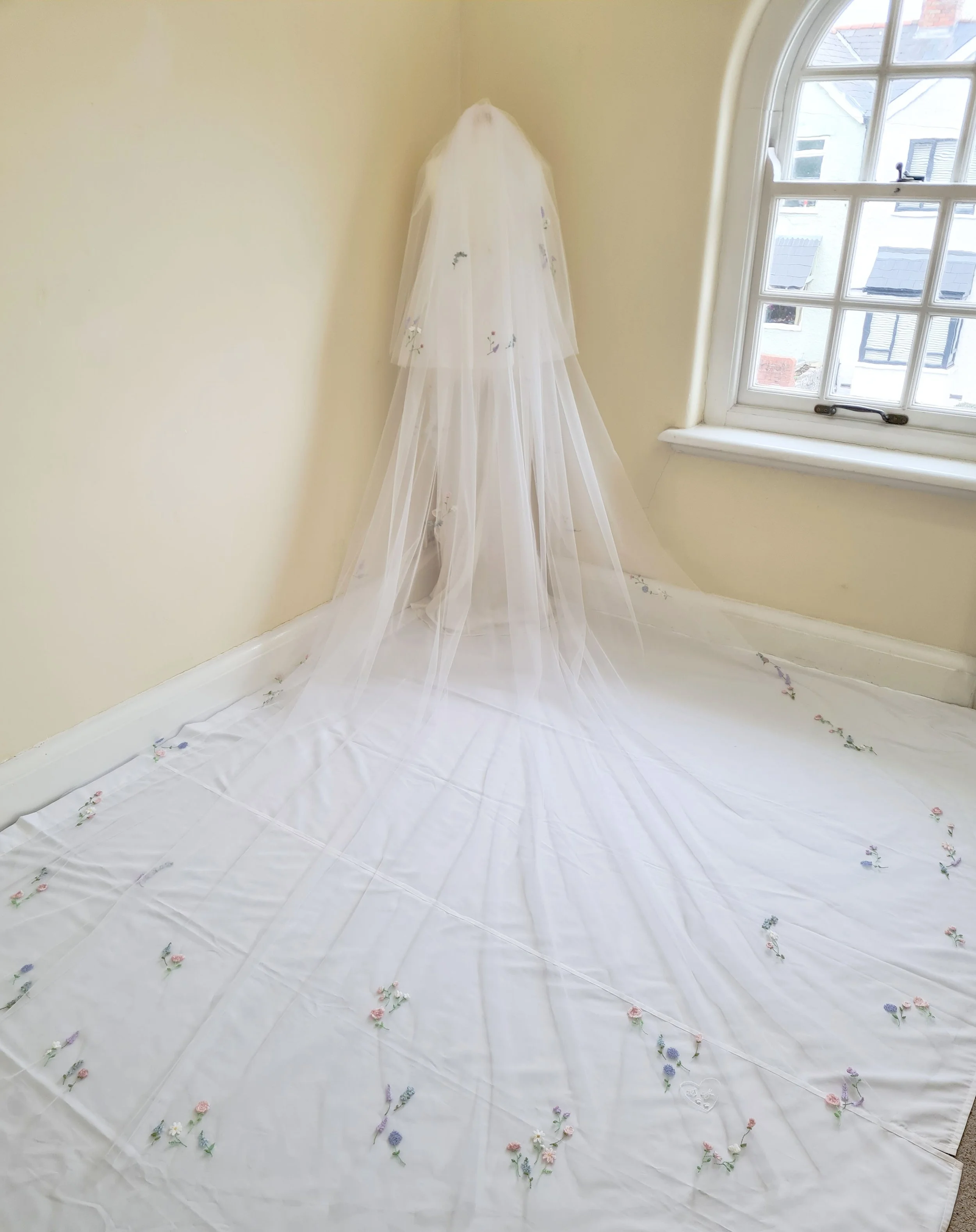 cathedral embroidered wedding veil with couture embroidered border design of hydrangea peony and daisy flowers in pastel colour palette
