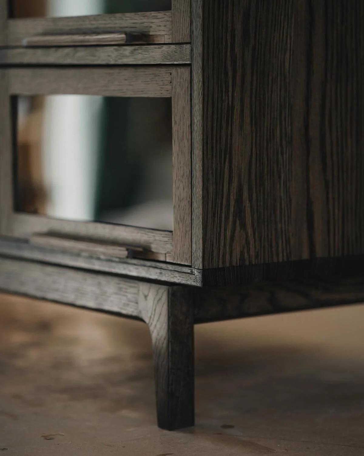 Ebony stained, white oak entertainment credenza, with barrister doors