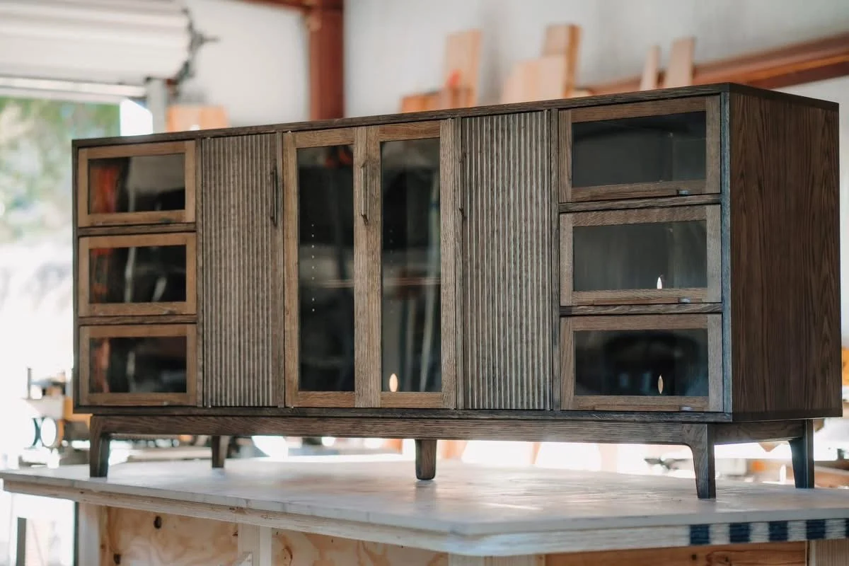 Ebony stained, white oak entertainment credenza, with barrister doors
