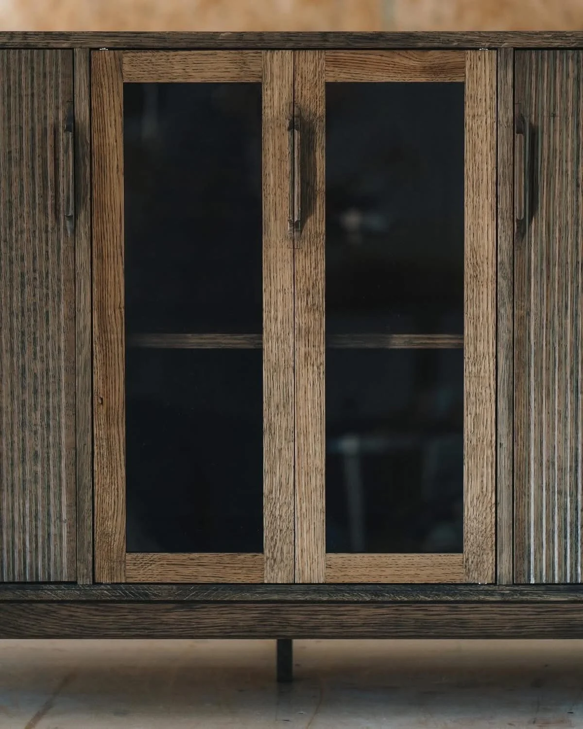 Ebony stained, white oak entertainment credenza, with barrister doors