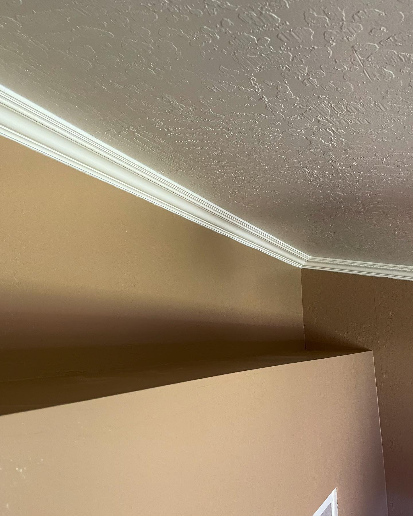 Crown molding installation on a vaulted ceiling. 🧼