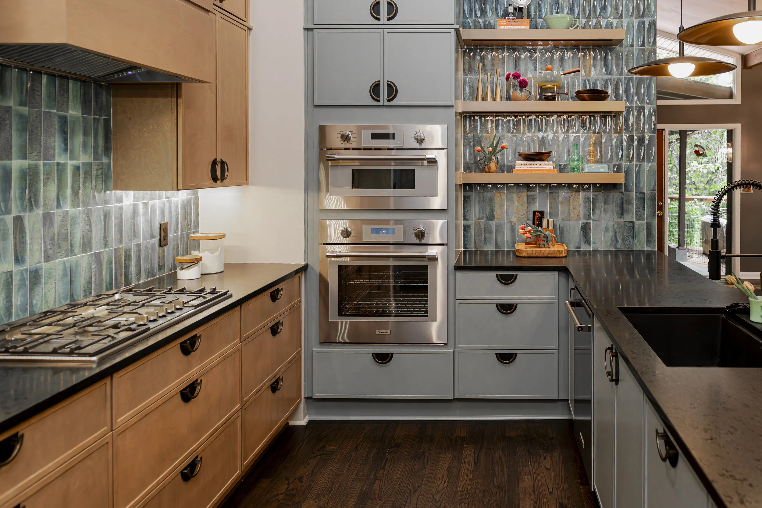 blue and green mid-century modern kitchen in Atlanta featuring wood cabinetry, minimalist fixtures, and timeless design by Violet Marsh Interiors
