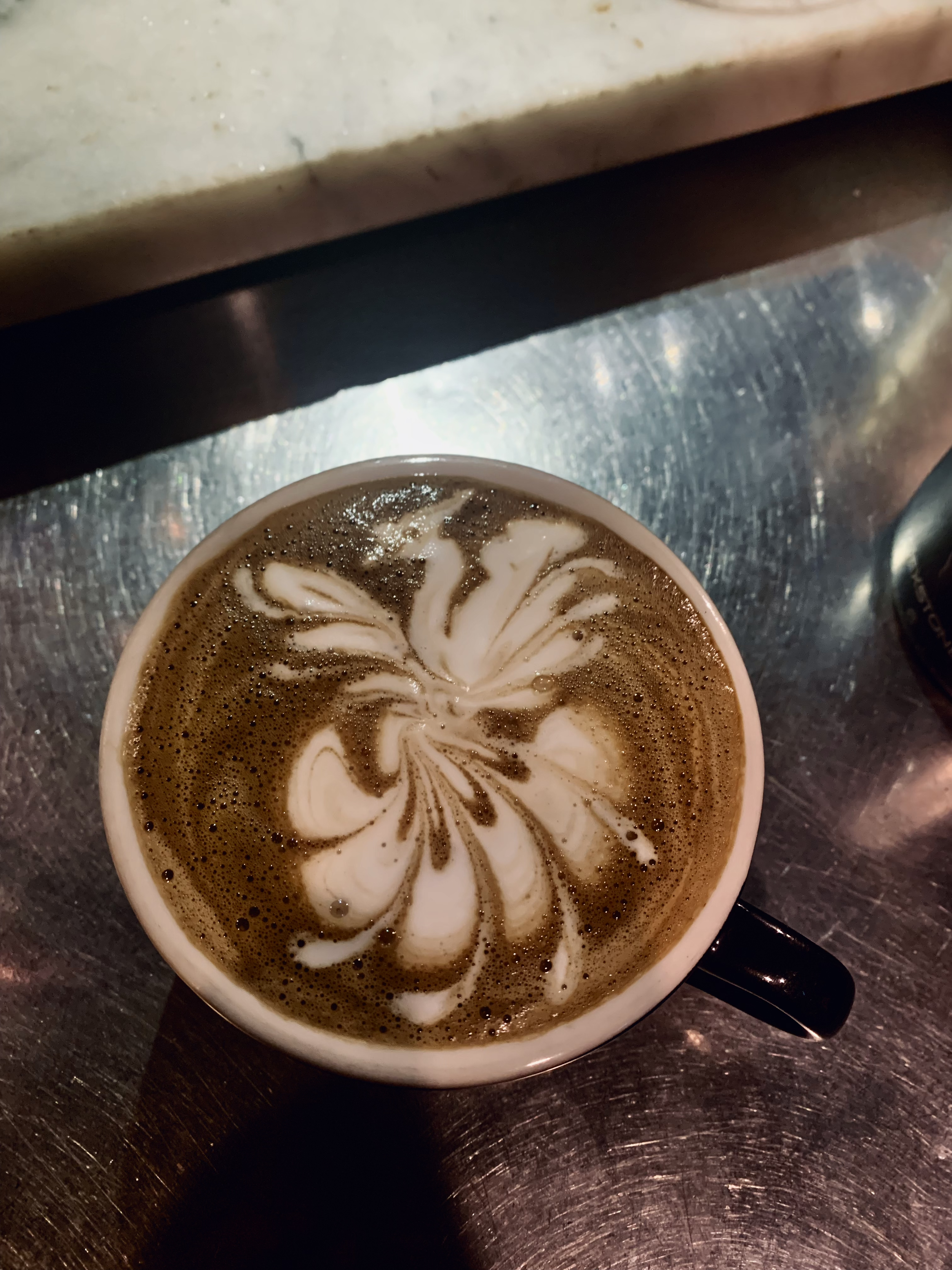 Practicing my latte art until I master the way of the milk