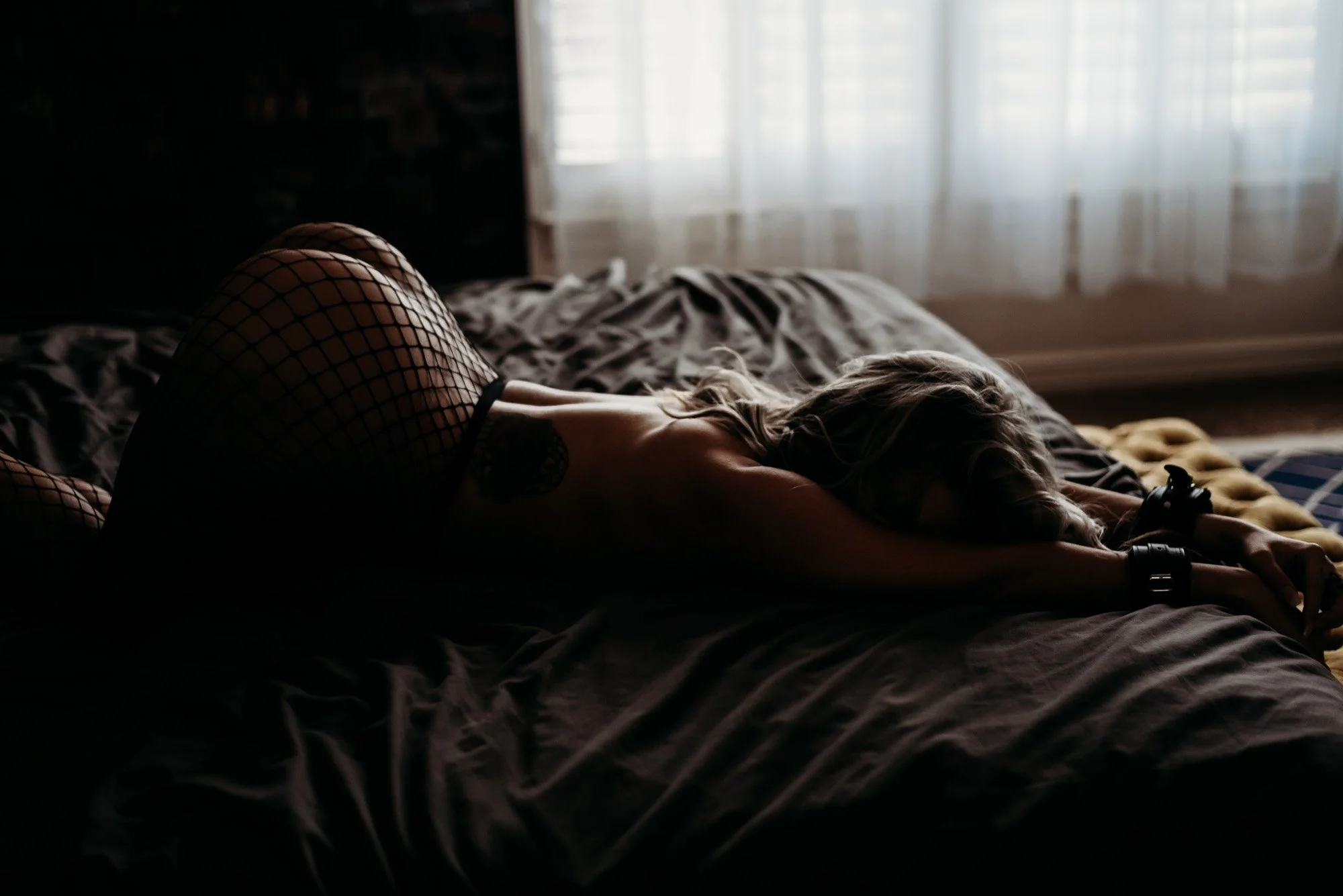 Dramatic high-contrast boudoir photography in Utah's Noir Room set