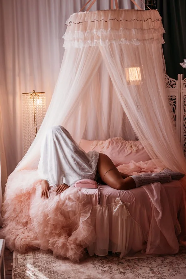 Sheet ghost lounging on pink ruffles next to a vintage pink phone, Ghosts Halloween mini
