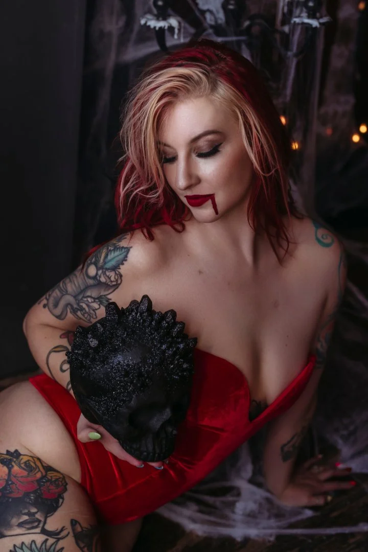 Gothic witch boudoir portrait with candlelight in a private Utah studio