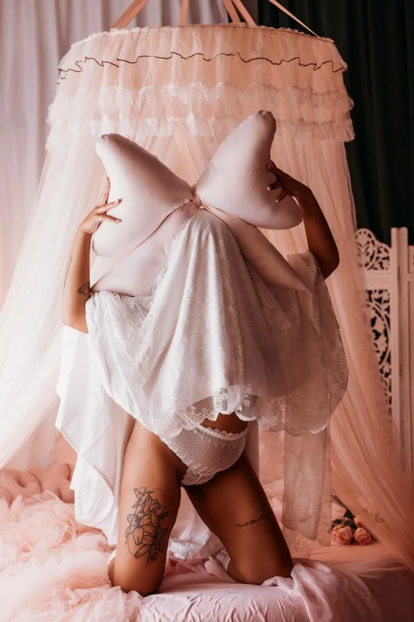 Ghosts set: kneeling sheet ghost hoisting an oversized pink bow, pink boudoir bedroom
