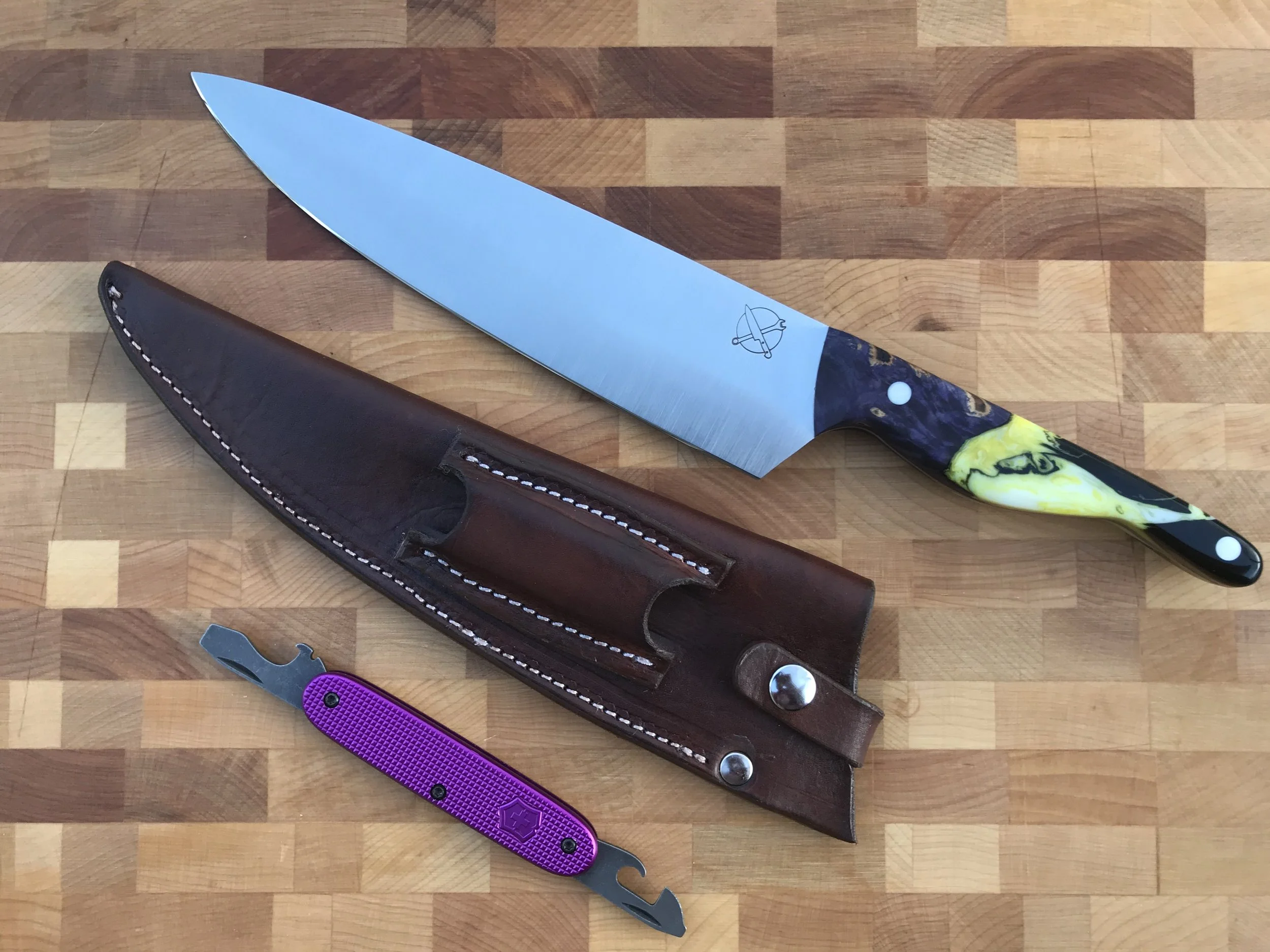 The Mule — 8" Chef's Knife in AEB-L | Dyed Purple Maple with Yellow & White Resin | Solid White ¼" Pins | Custom Leather Sheath & Beaver Blade Works Beer & Bean Tool with Custom Purple Ano Scales — GIFTED | A 50th birthday commission built around one
