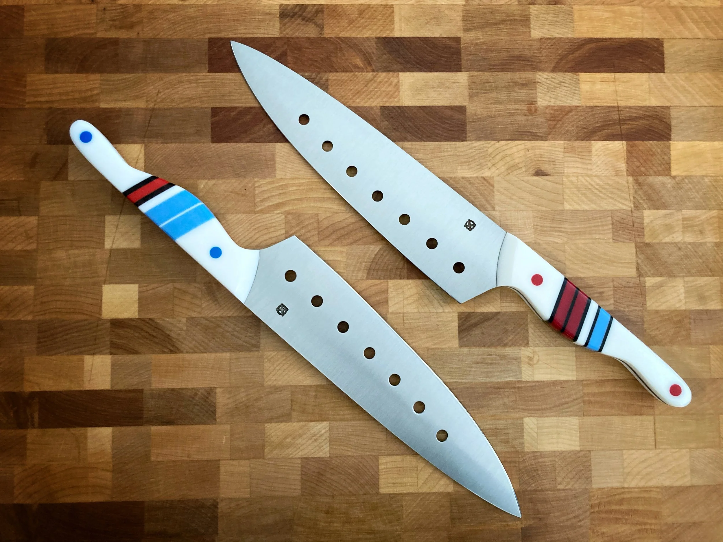 The Mule — Urban Outlaw Pair | 8" Chef's Knives in AEB-L | White Handle, Red & Blue Stripe Segments | Drilled Belly for Food Release — SOLD | Inspired by Magnus Walker and his Urban Outlaw film — two knives built as creative siblings after watching o