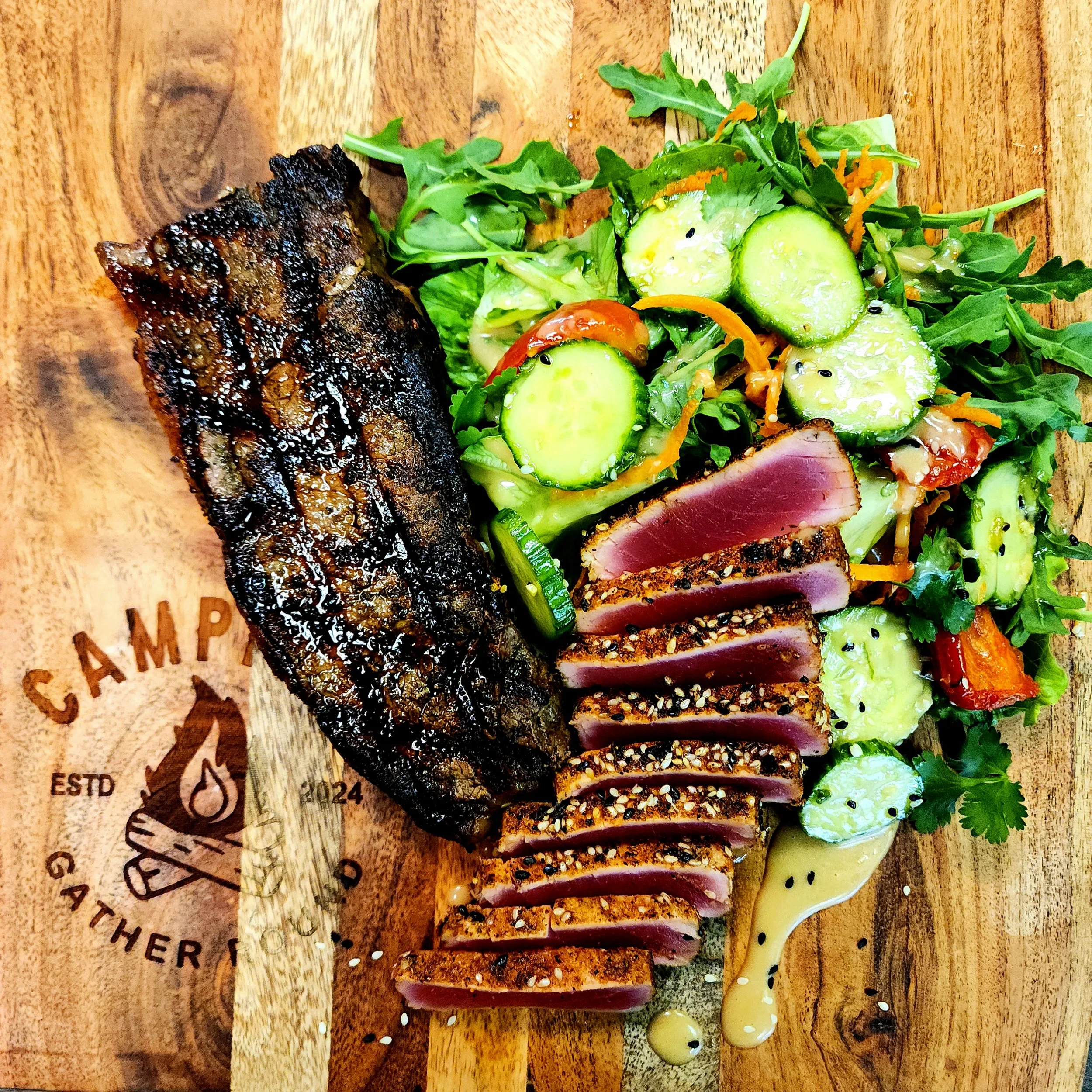 12oz Prime NY Strip, Blackened Ahi Tuna, & a Sesame Ginger Cucumber Salad.