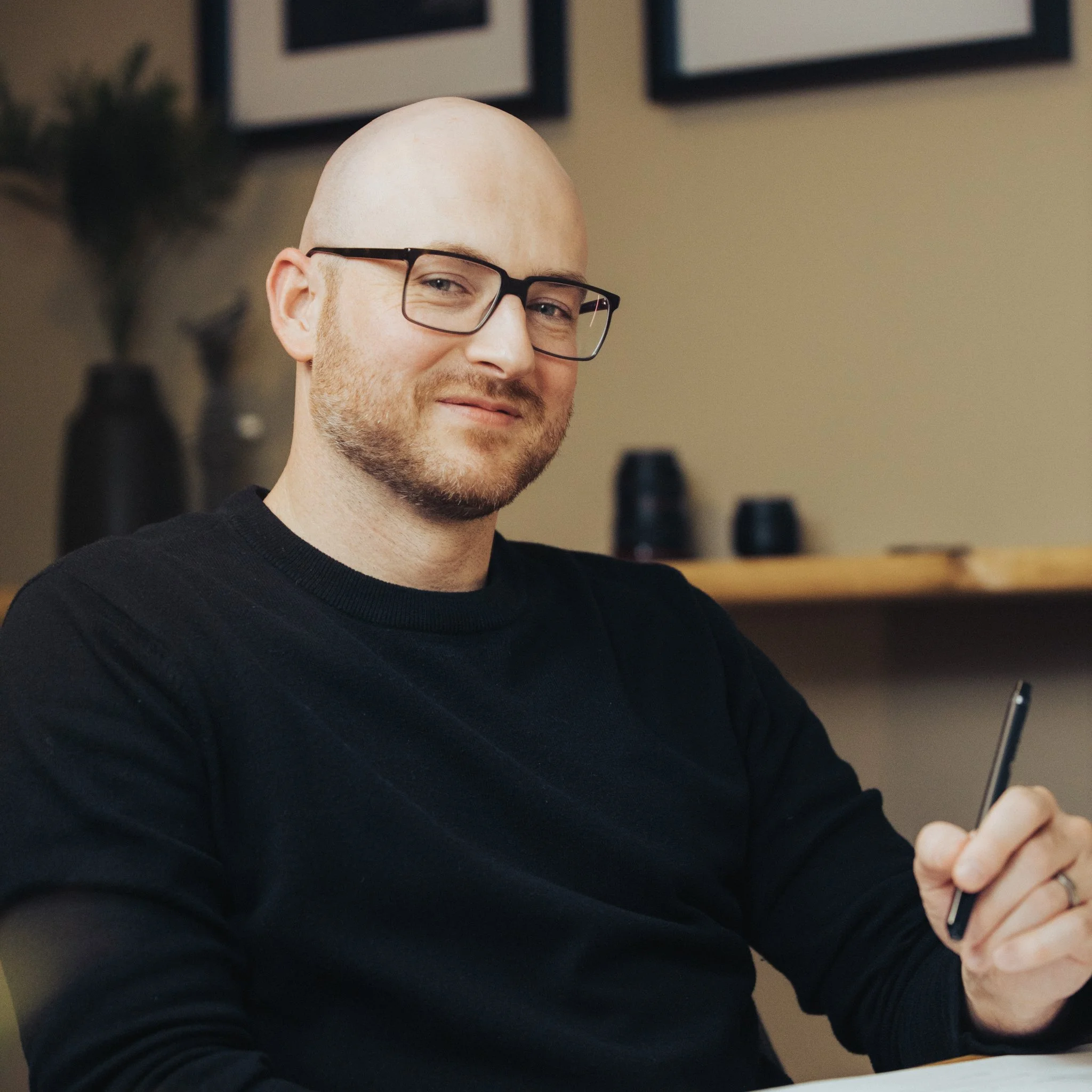 Photo by Anthem Image Marketing of Portrait photography services of man holding while smiling at camera. Anthem Image provides photography for Corporate headshots, travel photography, lifestyle photography, product shots, building photography.