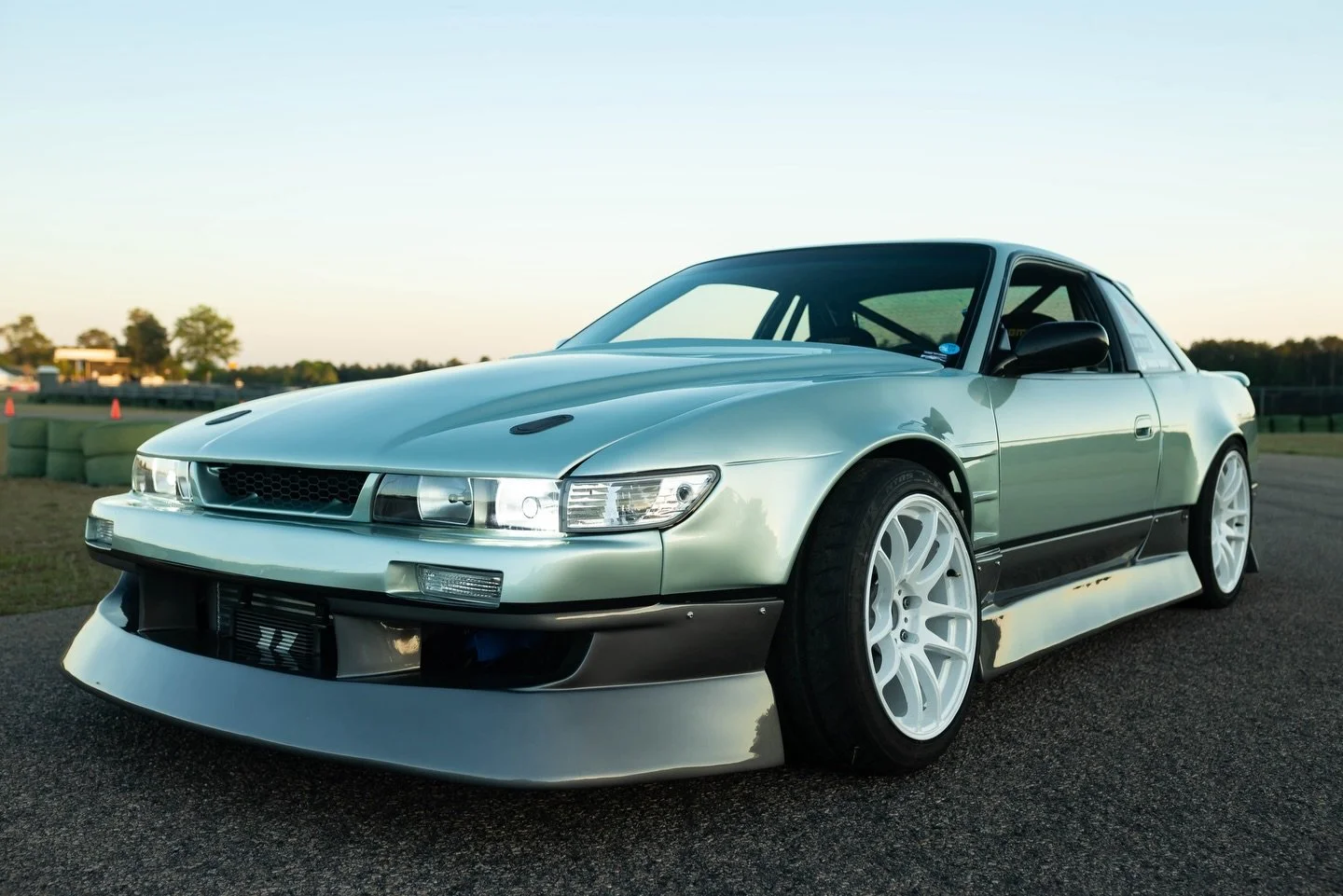 TWO TONE WHO DIS?

Sloan came through for a full refresh on his coupe. Fresh kit fitted and switched to Silvia front. Full color change inside and out from interior, roll cage, and trunk to color matched 2 tone engine bay. The outside is the famous N