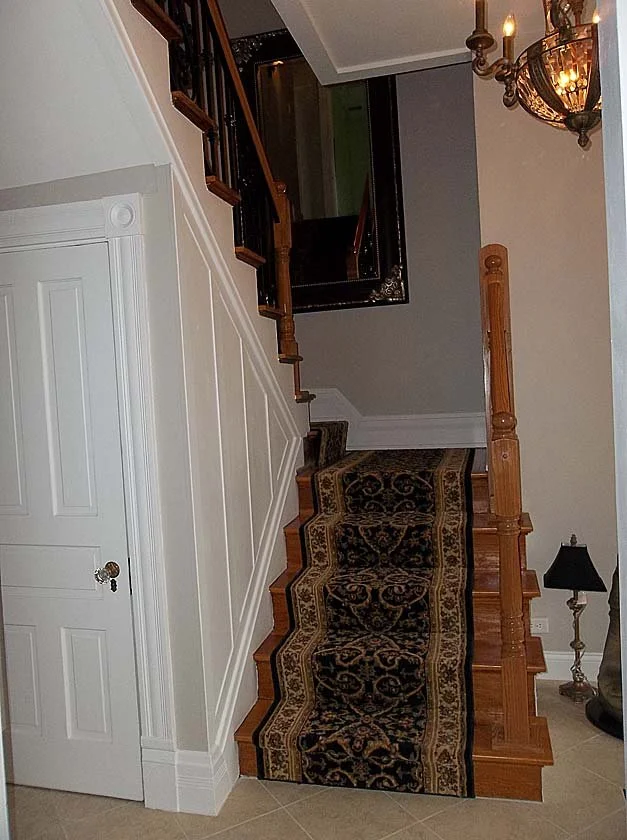 Stairway with wrought iron railings.