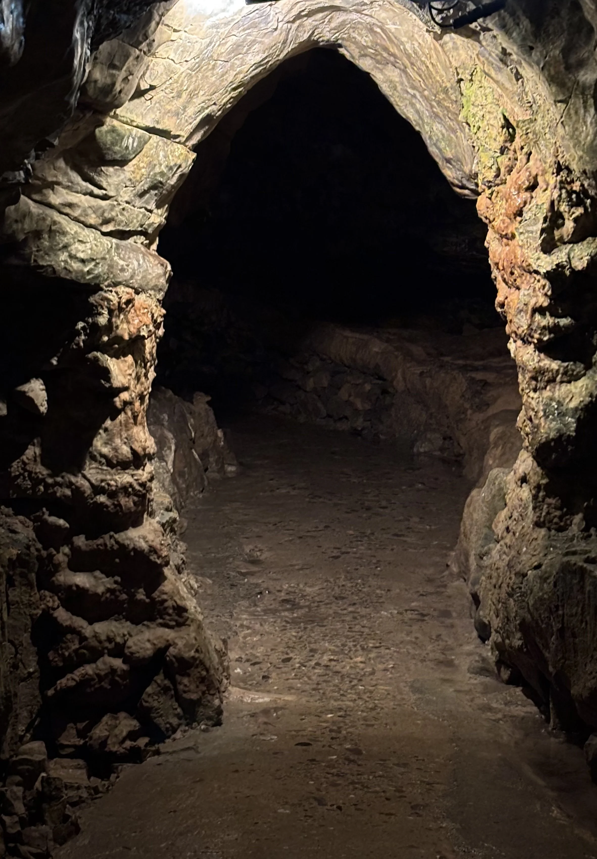 I am inside rock. The way is dark.