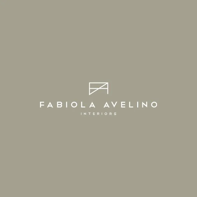 Logo of Fabiola Avelino Interiors on a taupe background, featuring stylized geometric design above the brand name in white text.