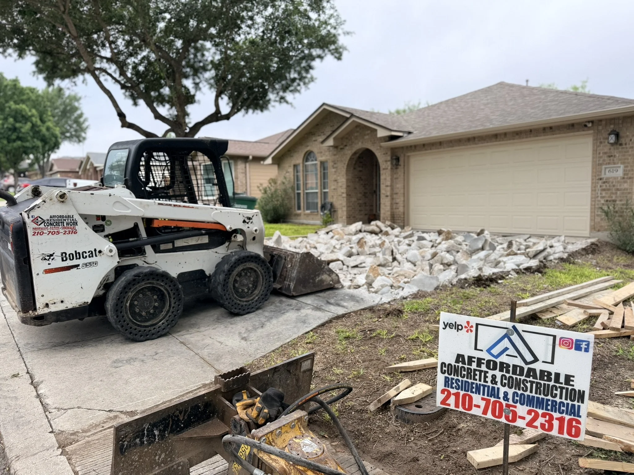 Concrete driveway demolition and replacement project in San Antonio, TX by Affordable Concrete & Construction. Existing concrete removal and site preparation for a new reinforced concrete driveway.