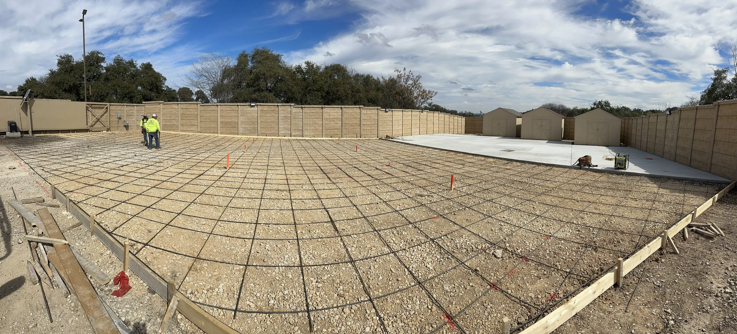Steel rebar reinforcement and site preparation for a concrete driveway installation in San Antonio, TX. Affordable Concrete & Construction uses reinforced concrete construction for strength, durability, and long-term performance.