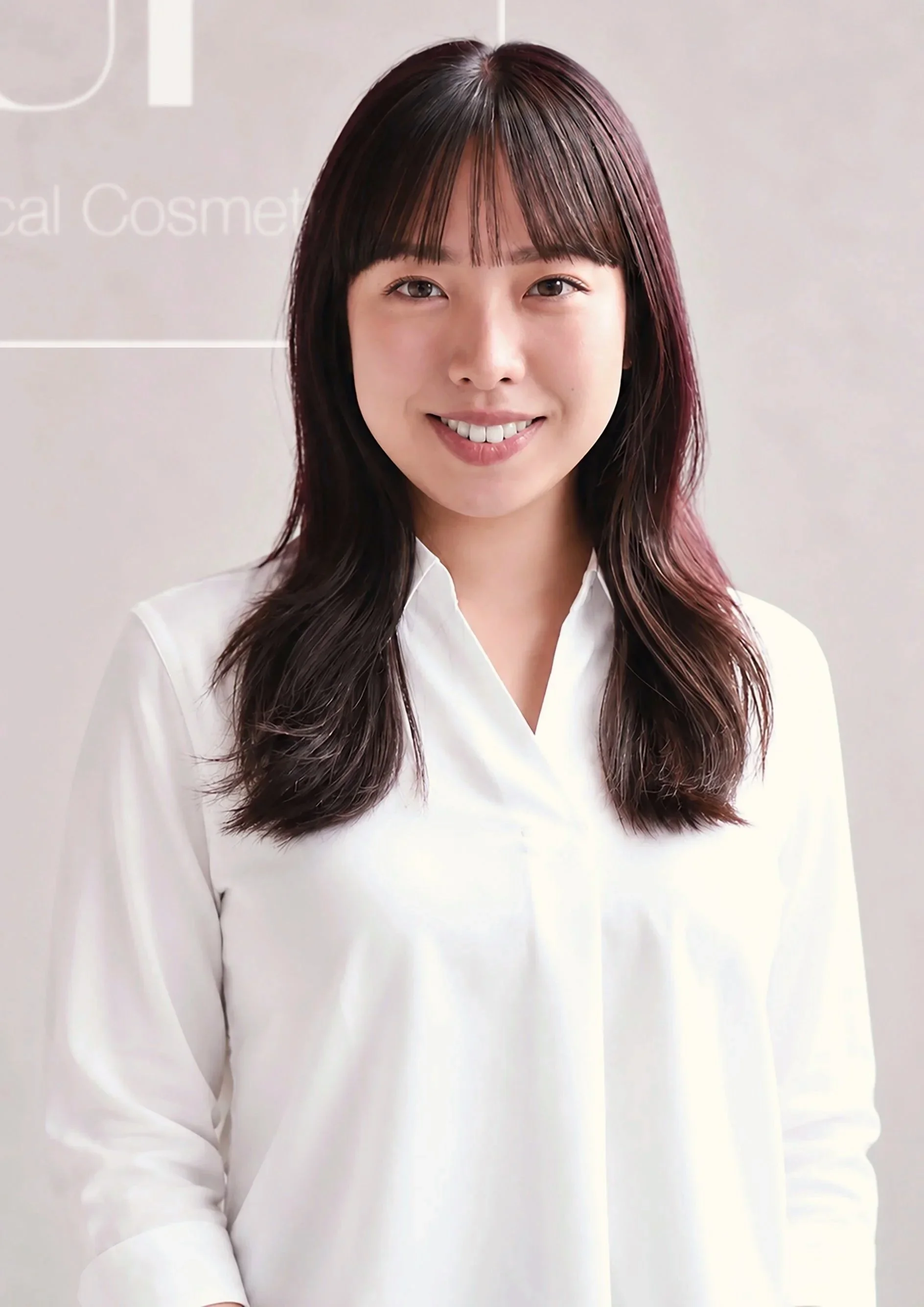 UP® Clinical Cosmetics team member welcoming clients in reception.