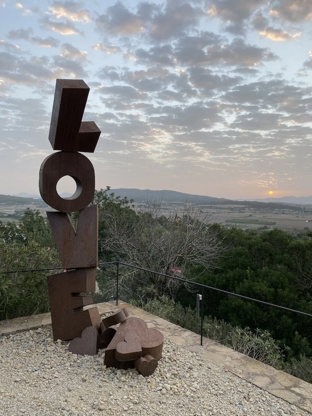Sculpture saying love with hearts 