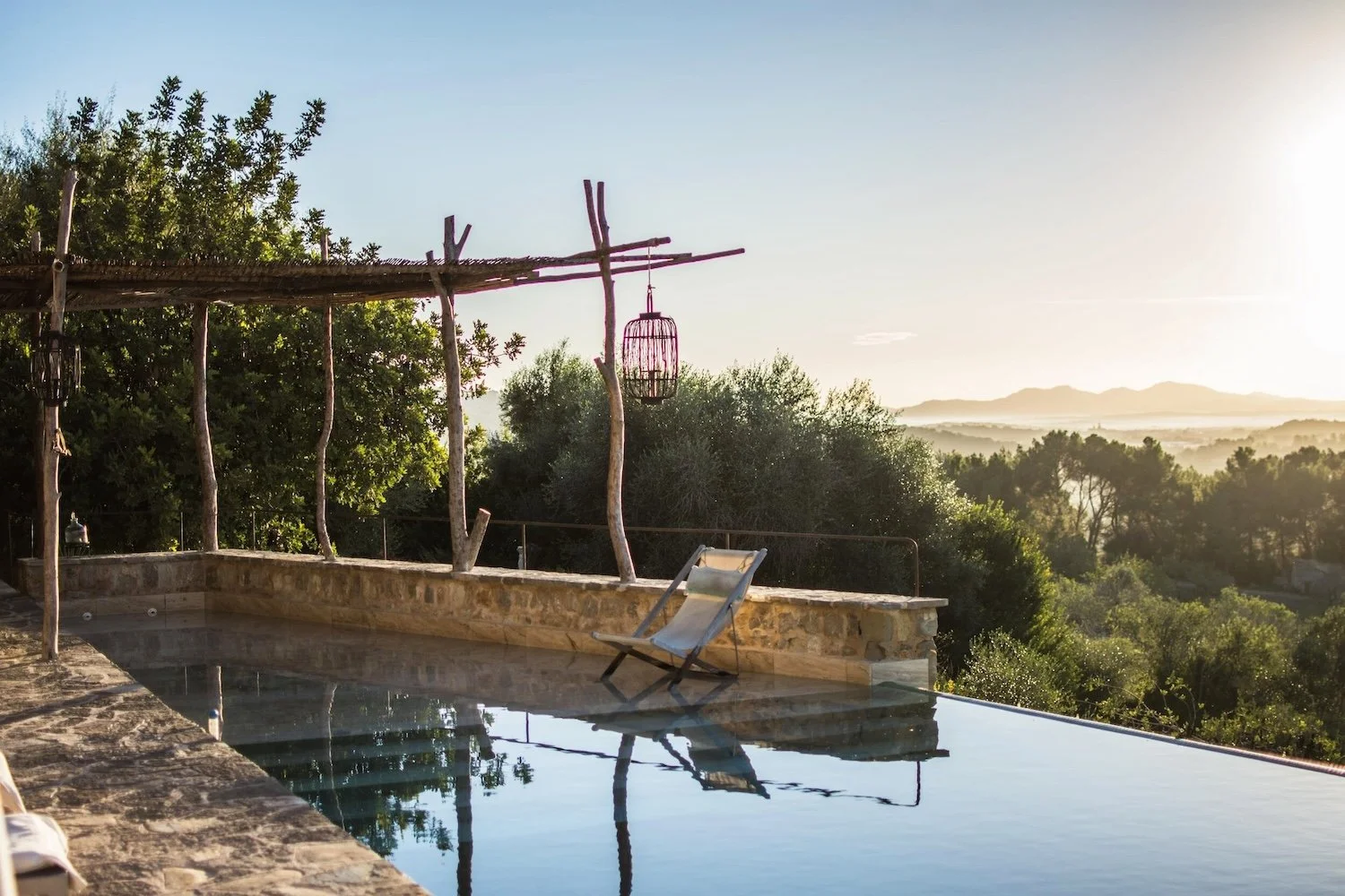 Pool at sunset with deck chair