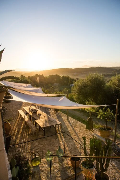 Large wooden table finca during sunset