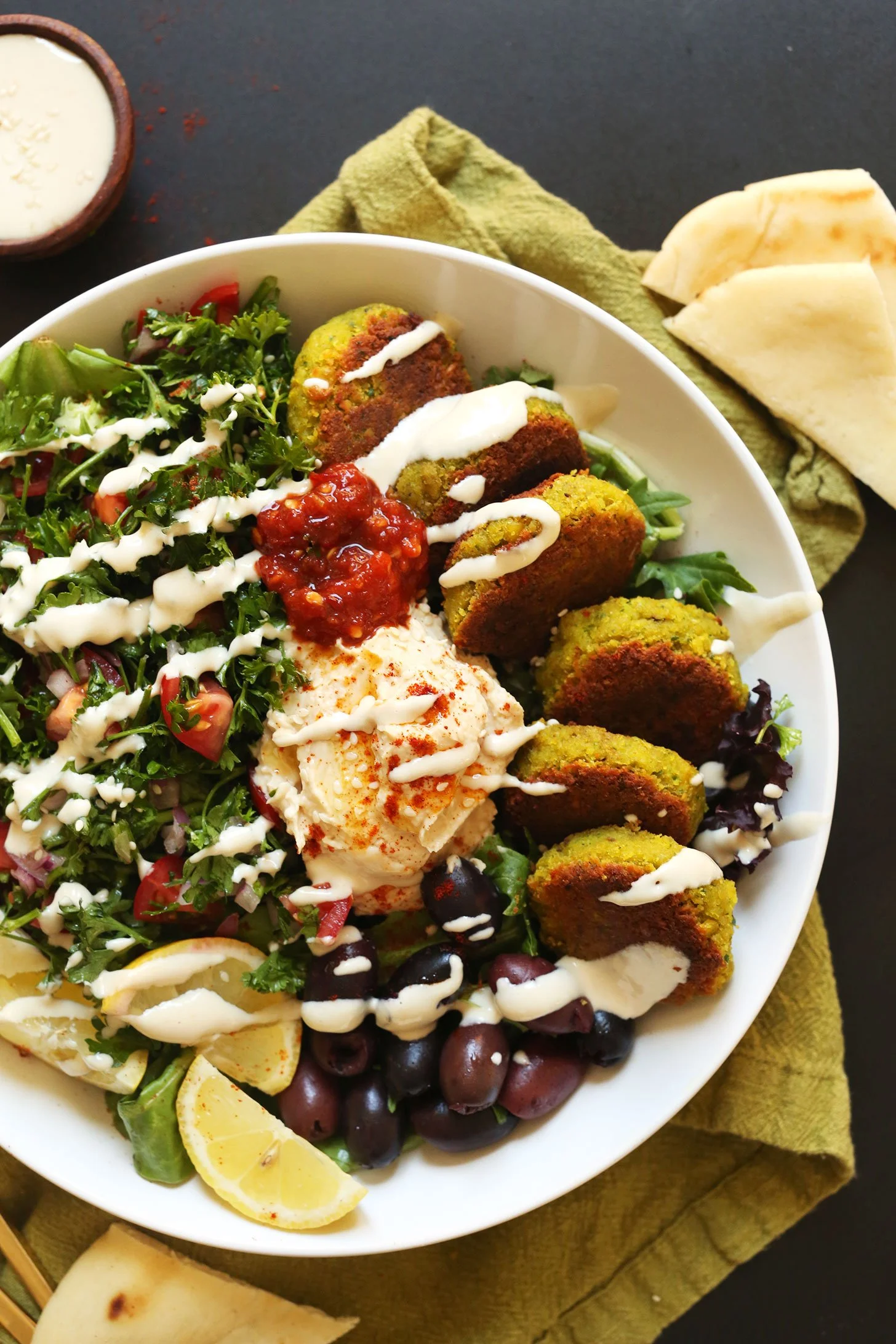 The-ULTIMATE-Mediterranean-Bowl-with-hummus-falafel-tahini-sauce-olives-and-pita-vegan-glutenfree-falafel-recipe-healthy-easy.jpeg